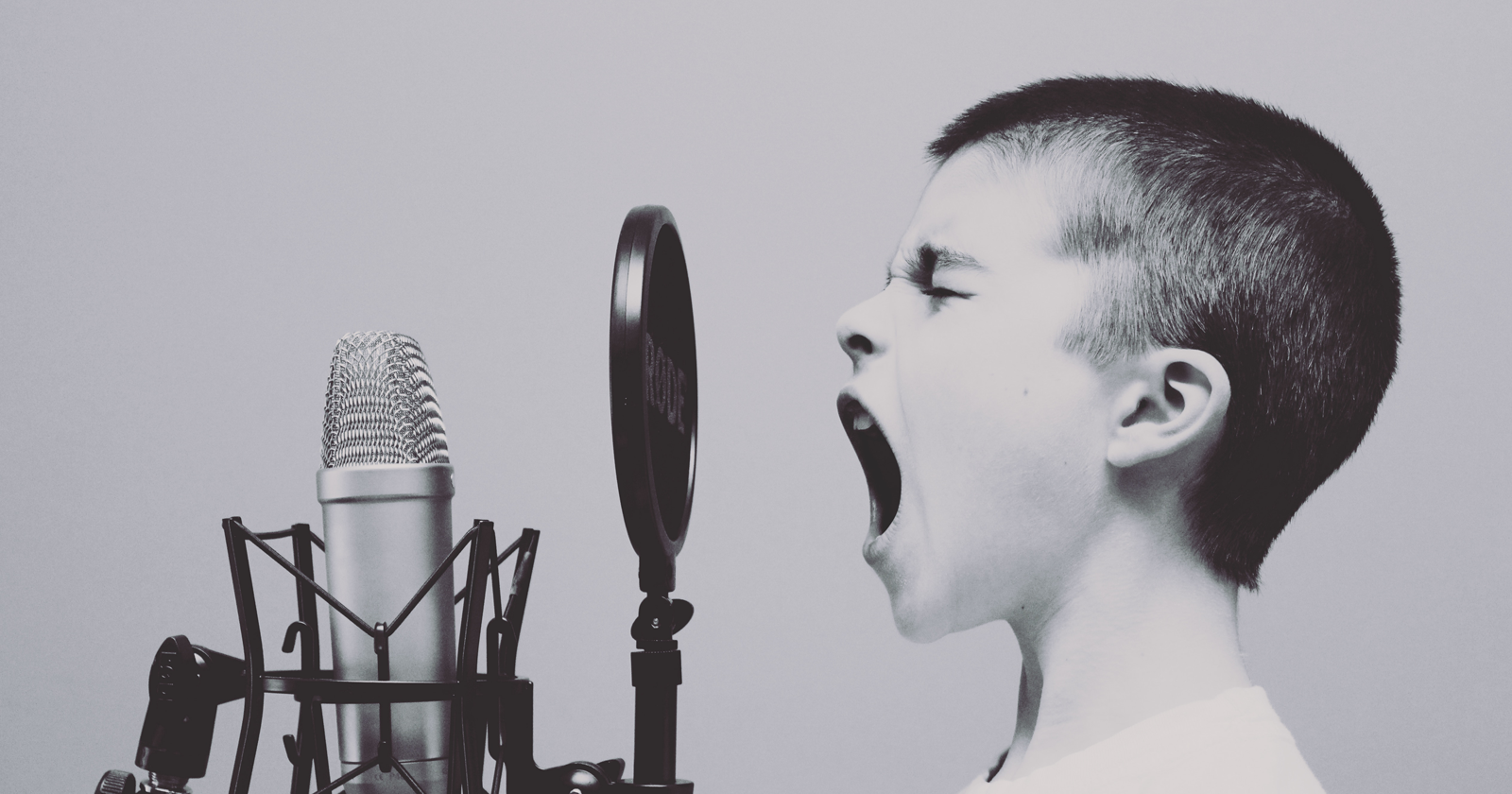 kid shouting into microphone