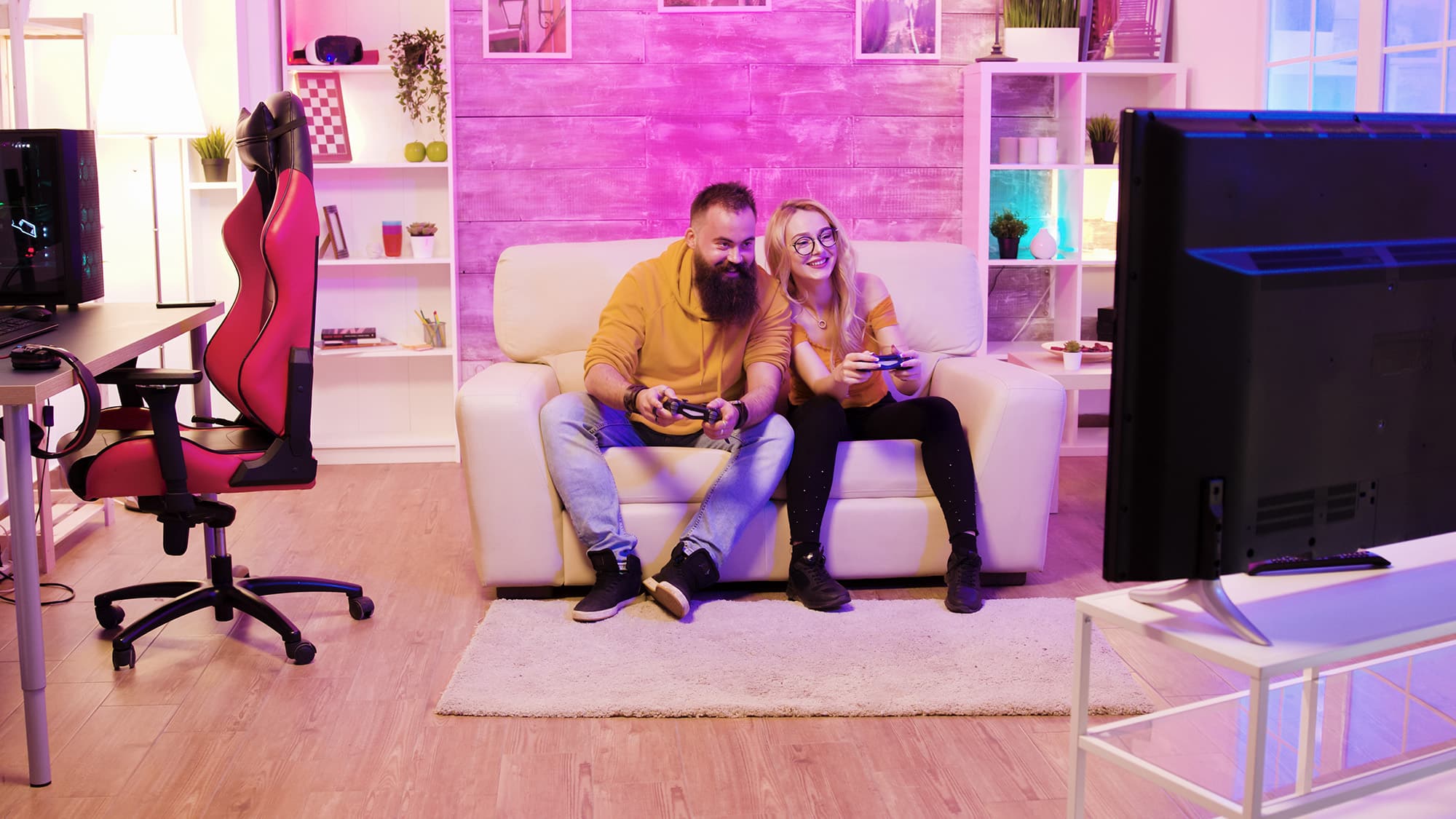 couple on couch playing video games together