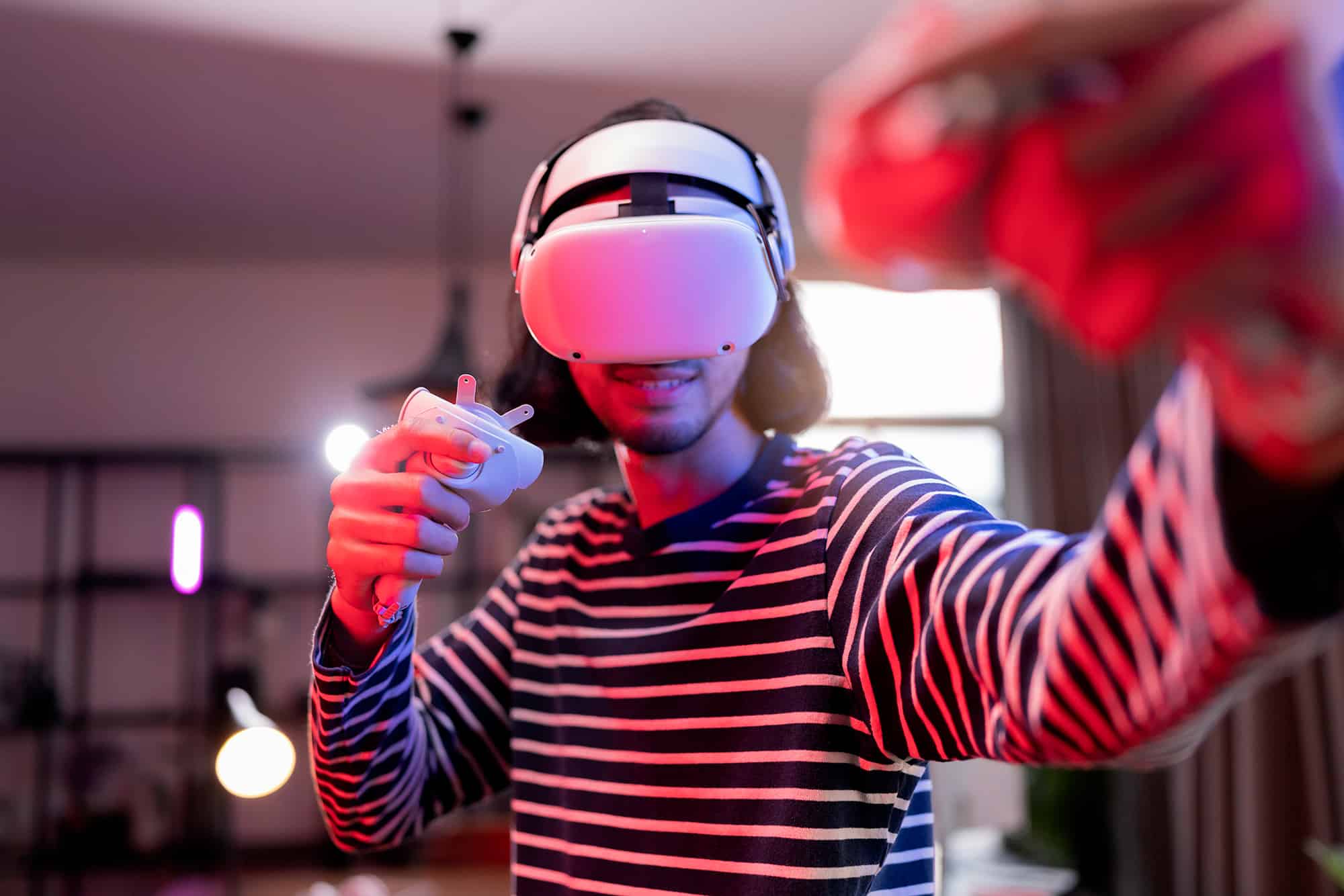 man with VR Visor playing video games